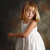 Portrait of a 7 year old girl dancing photographed in the studio of Dinan Photo, Belleville IL
